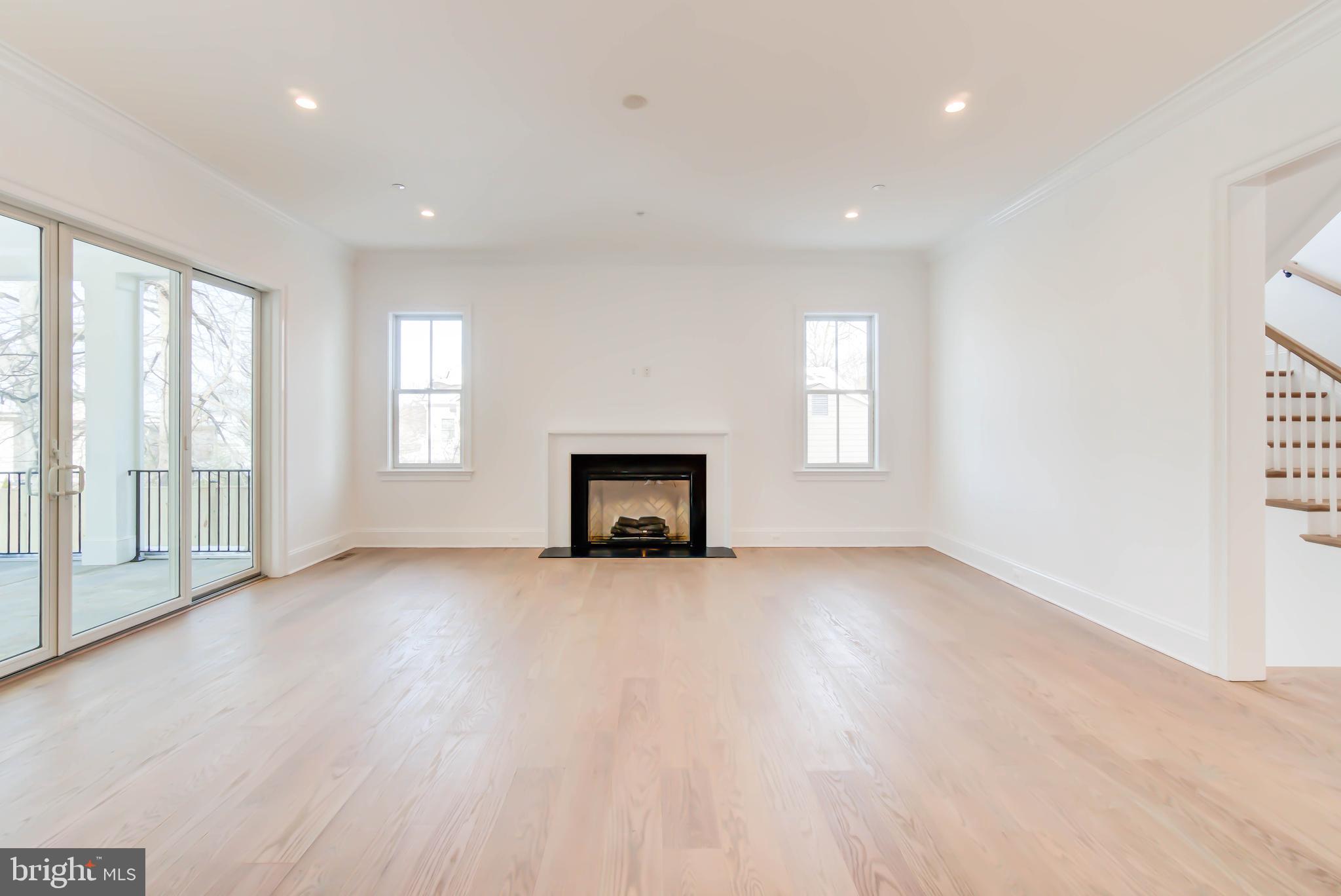 7408 Pyle Road Bethesda, MD 20817 - Photo 29 of 81 a view of an empty room with a window and wooden floor