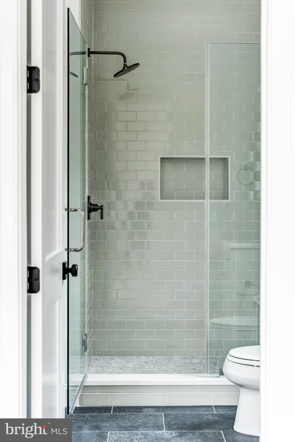 7408 Pyle Road Bethesda, MD 20817 - Photo 35 of 81 a bathroom with a shower and a toilet