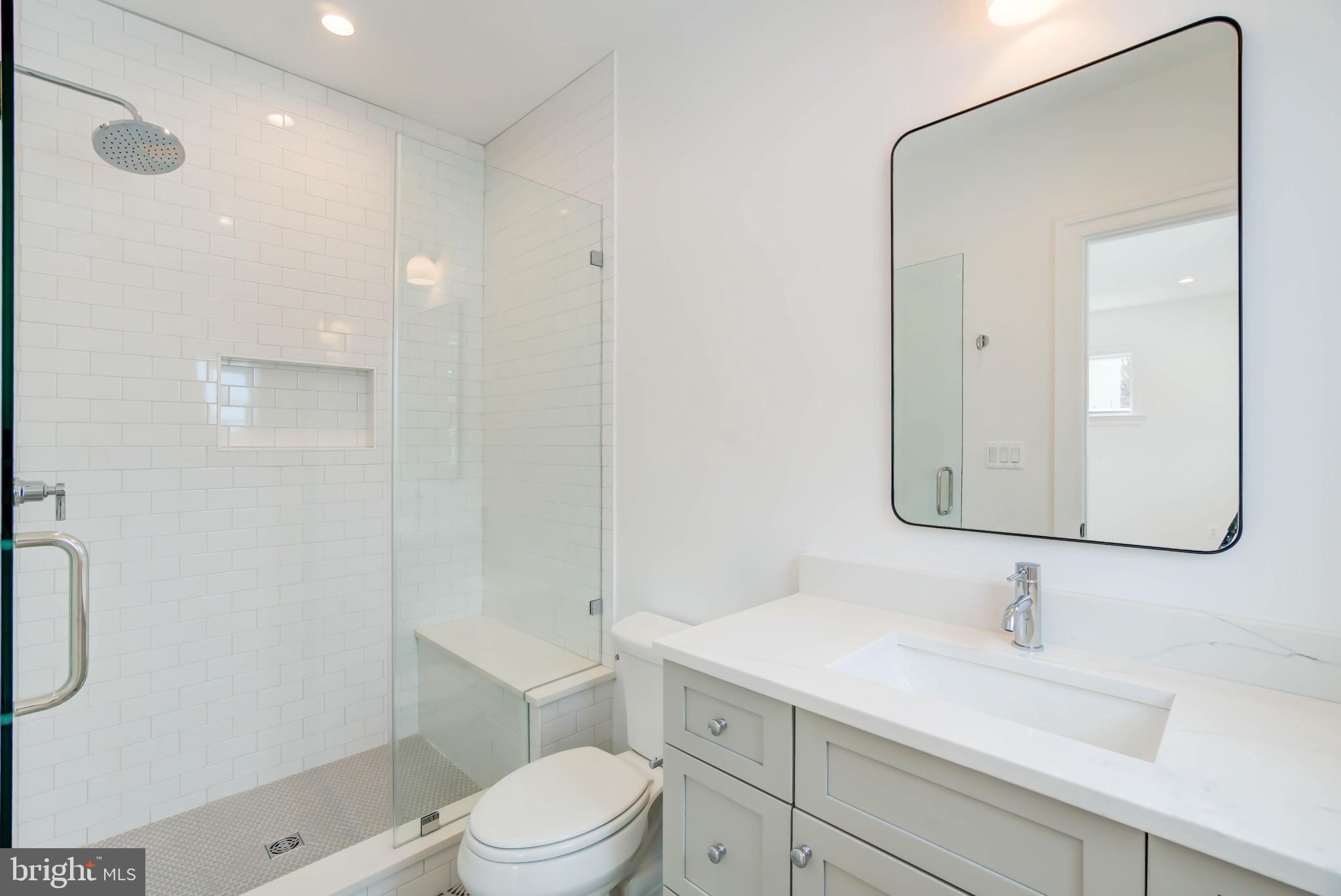 7408 Pyle Road Bethesda, MD 20817 - Photo 60 of 81 a bathroom with a sink a toilet and shower