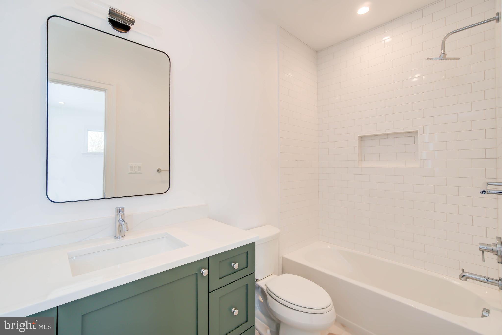7408 Pyle Road Bethesda, MD 20817 - Photo 63 of 81 a bathroom with a toilet a sink a mirror and vanity
