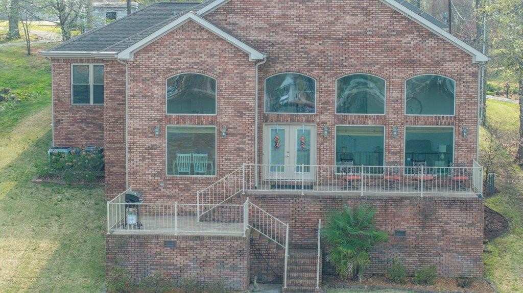 331 Carson Road Muscle Shoals, AL 35661 - Photo 2 of 38 front view of a brick house with large windows