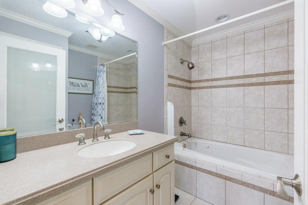 331 Carson Road Muscle Shoals, AL 35661 - Photo 30 of 38 a bathroom with a sink double vanity granite tub shower and a mirror
