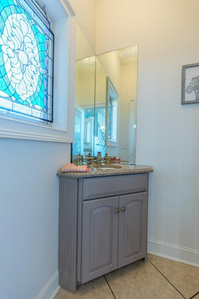 331 Carson Road Muscle Shoals, AL 35661 - Photo 32 of 38 a bathroom with a sink and a mirror