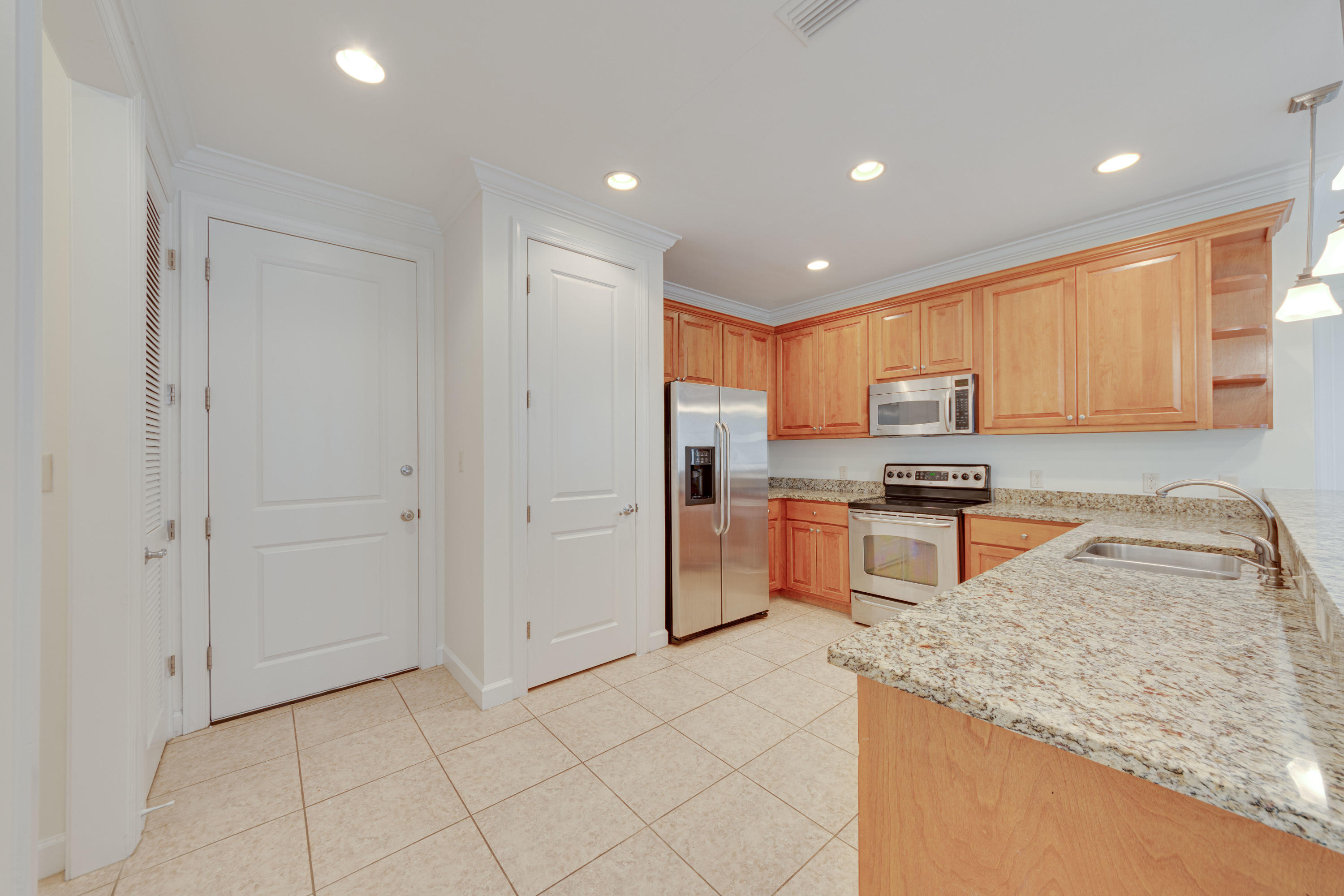 164 South Zander Way Santa Rosa Beach, FL 32459 - Photo 11 of 51 a kitchen with stainless steel appliances granite countertop a refrigerator and a sink