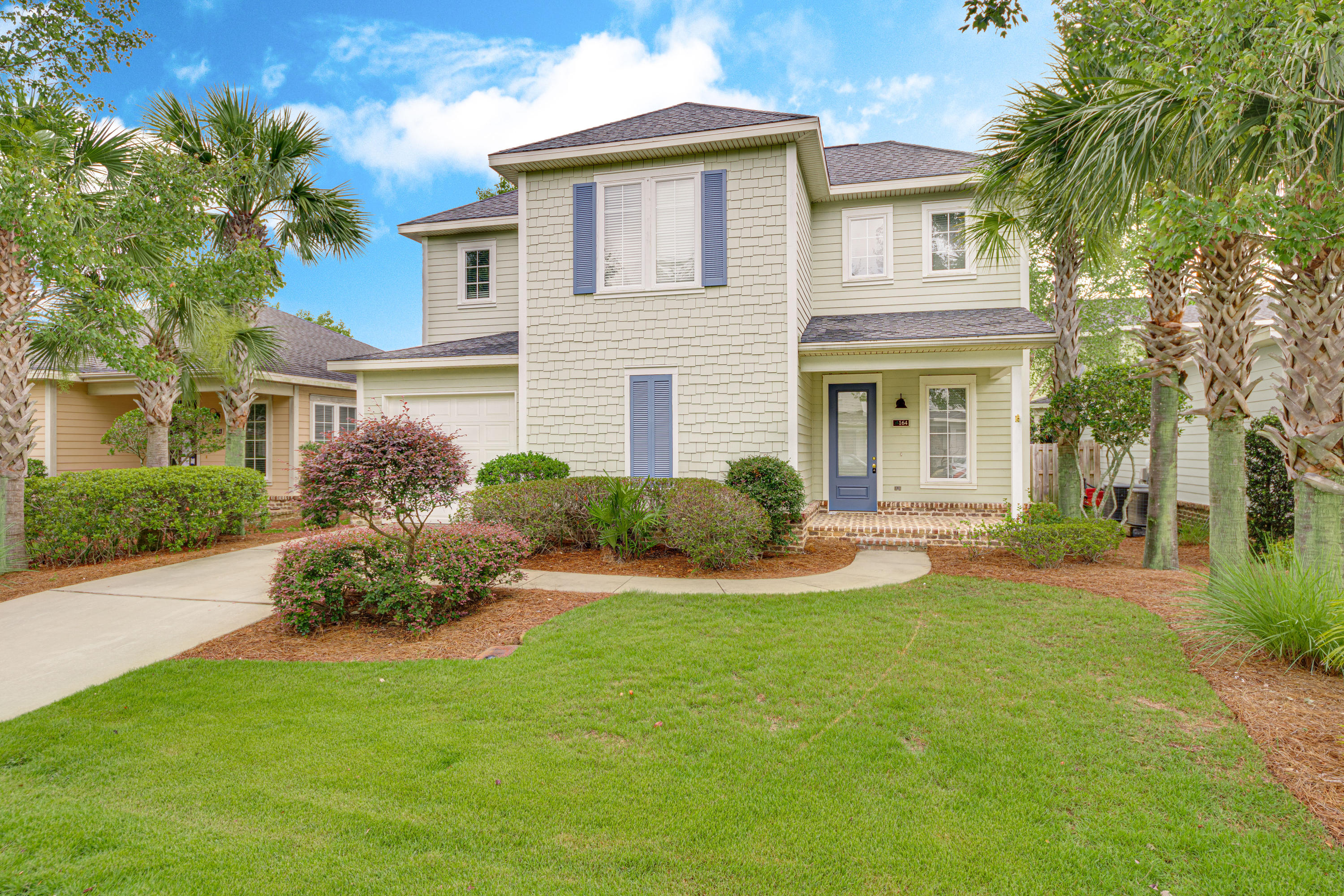 164 South Zander Way Santa Rosa Beach, FL 32459 - Photo 2 of 51 a front view of a house with garden