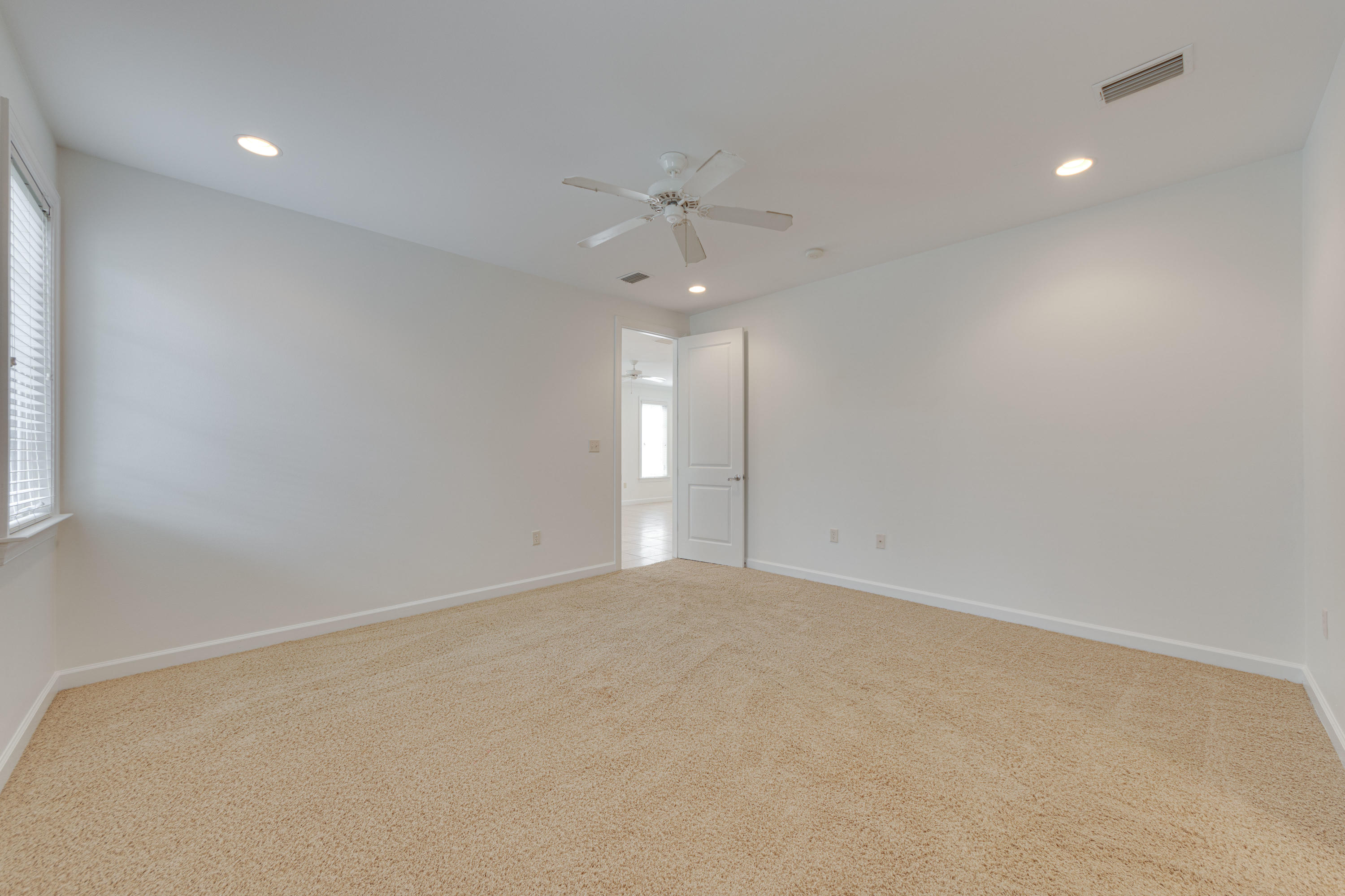 164 South Zander Way Santa Rosa Beach, FL 32459 - Photo 21 of 51 an empty room with fan and windows