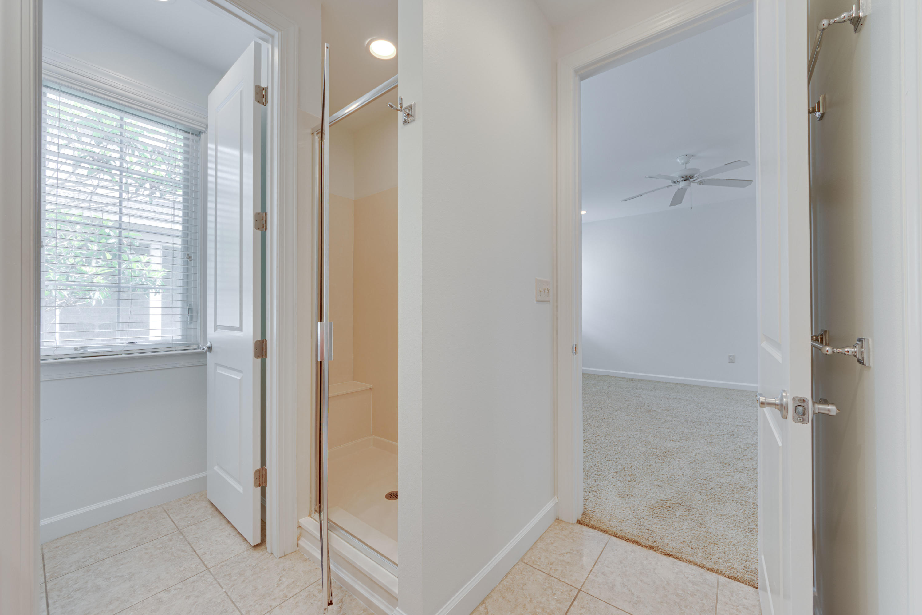 164 South Zander Way Santa Rosa Beach, FL 32459 - Photo 25 of 51 a bathroom with a glass shower door and a bathtub