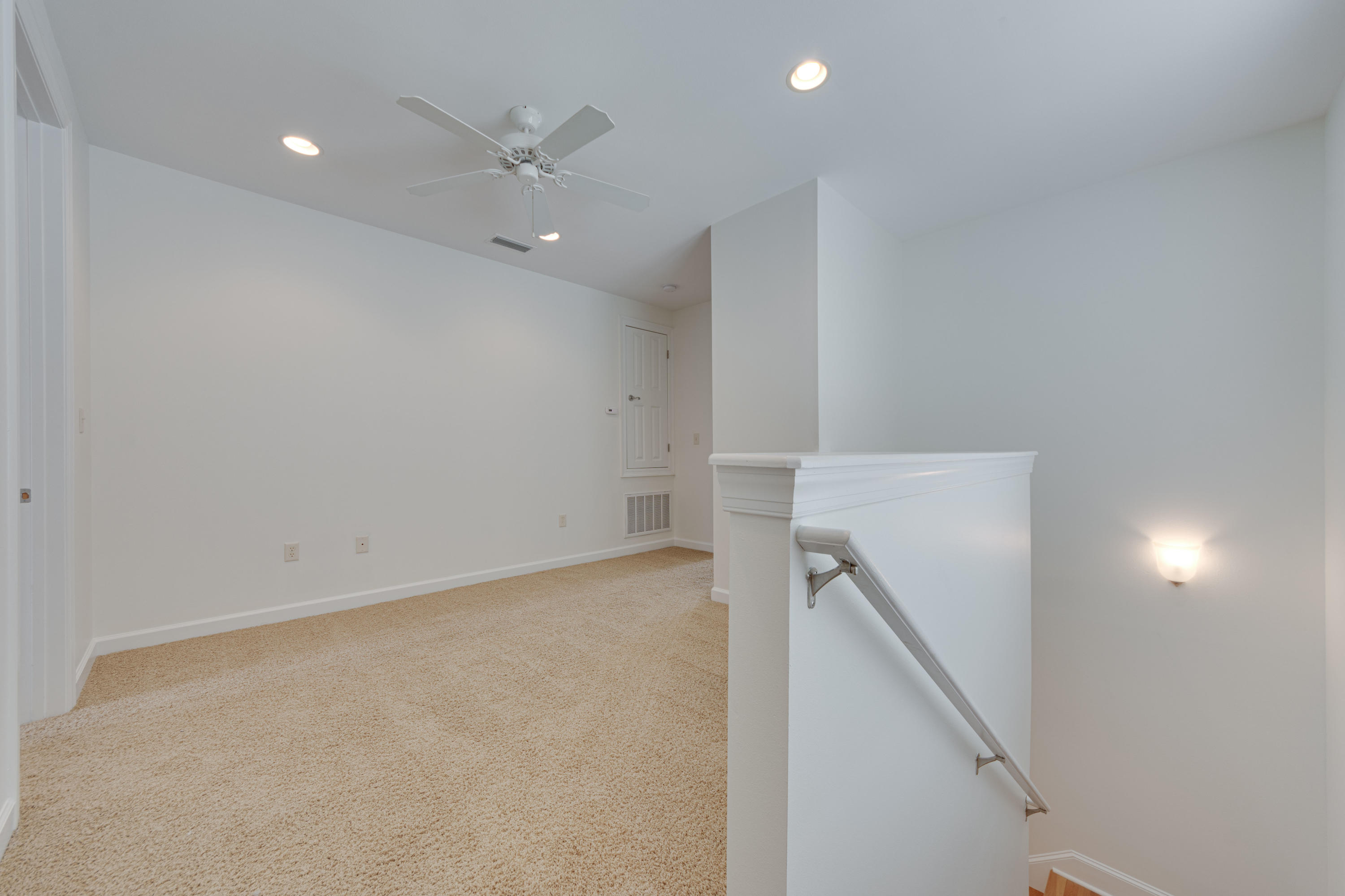 164 South Zander Way Santa Rosa Beach, FL 32459 - Photo 29 of 51 an empty room with a ceiling fan and hallway