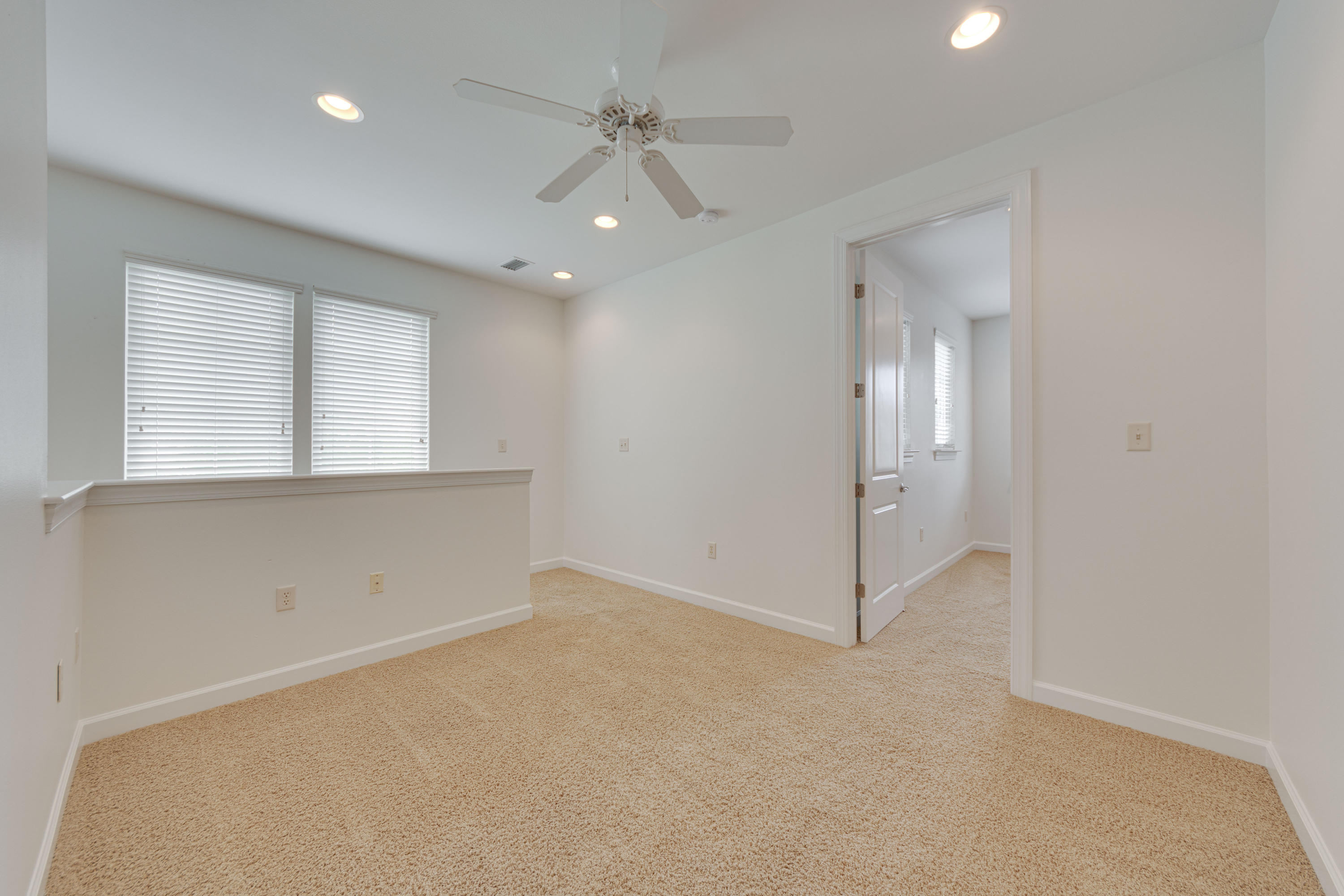 164 South Zander Way Santa Rosa Beach, FL 32459 - Photo 32 of 51 an empty room with windows and fan
