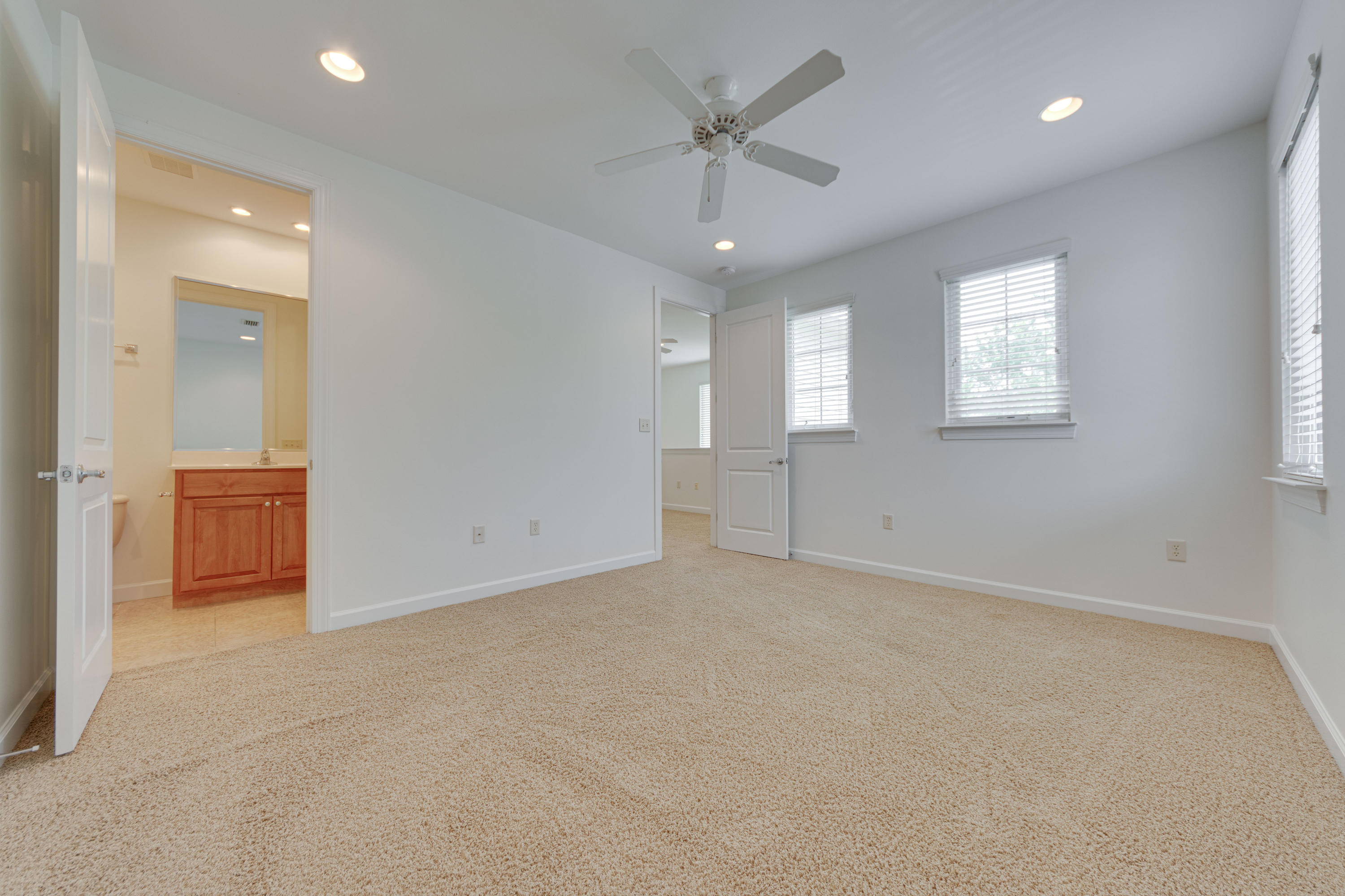 164 South Zander Way Santa Rosa Beach, FL 32459 - Photo 35 of 51 an empty room with chandelier fan and windows