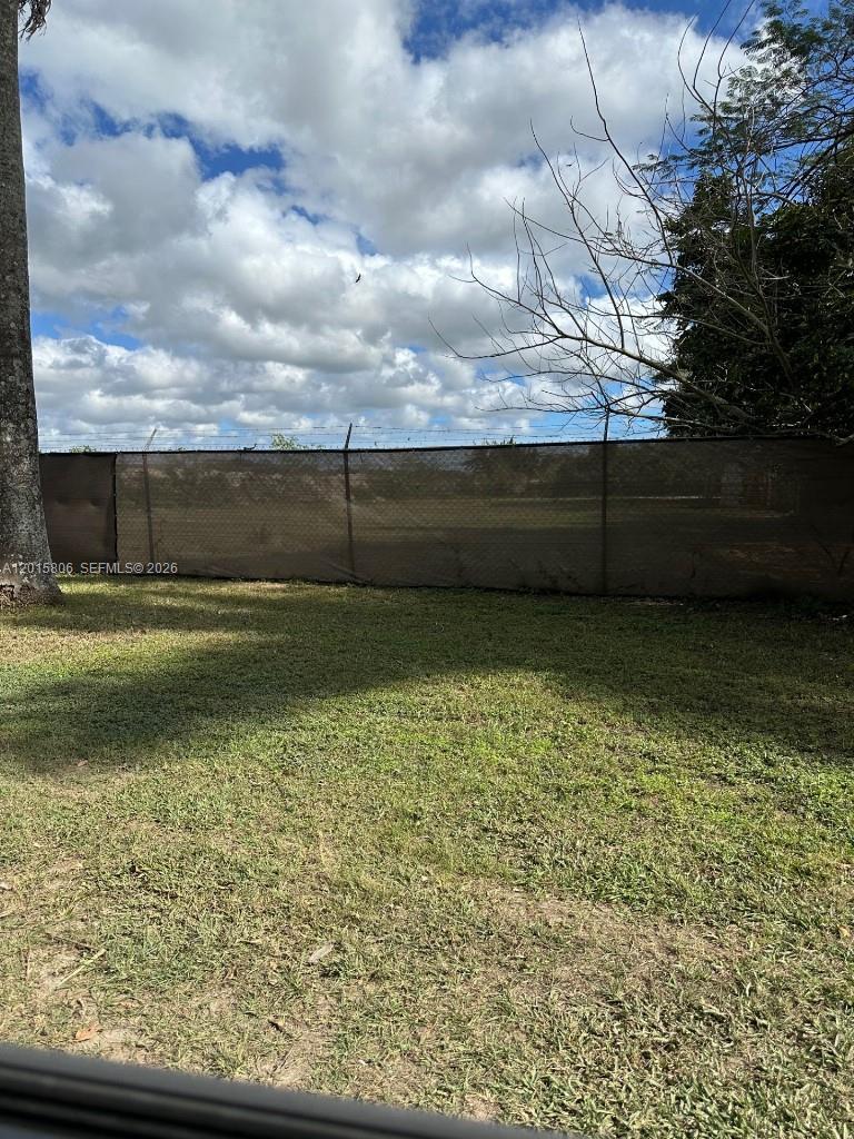 19191 Southwest 232nd Street Miami, FL 33170 - Photo 6 of 10 a view of a yard