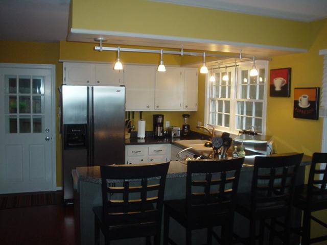 2962 Tree Swallow Road Roanoke, VA 24018 - Photo 5 of 21 a kitchen with stainless steel appliances a table chairs and a refrigerator