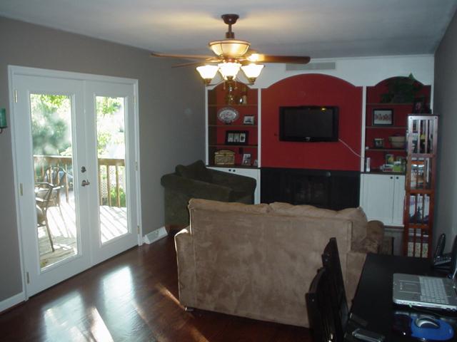 2962 Tree Swallow Road Roanoke, VA 24018 - Photo 7 of 21 a living room with furniture a chandelier and a large window