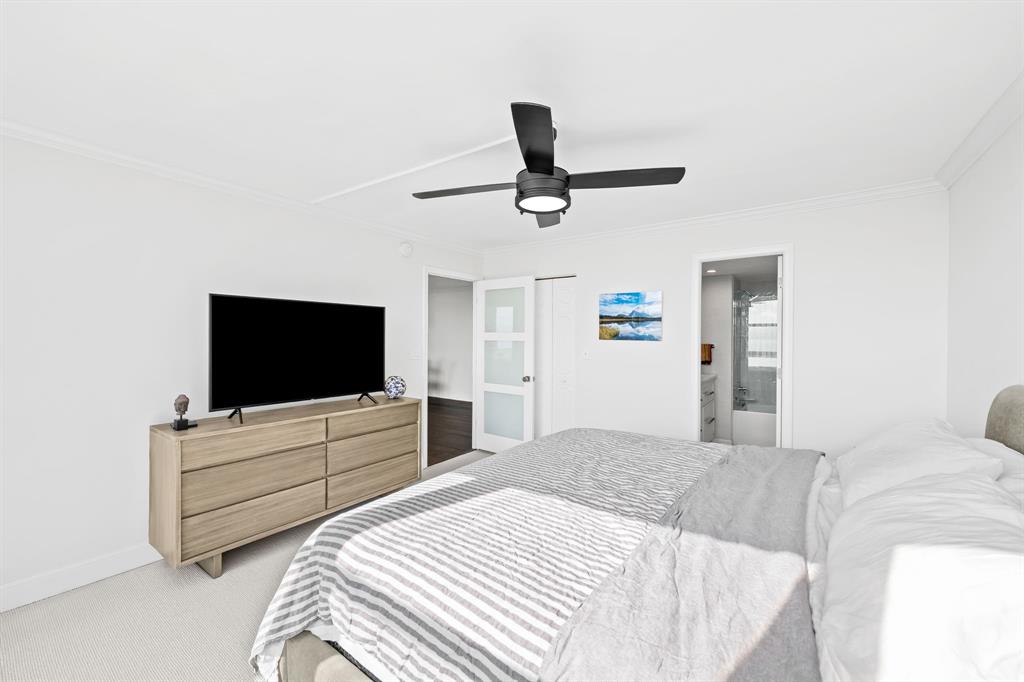 2841 North Ocean Boulevard, Unit 1508 Fort Lauderdale, FL 33308 - Photo 11 of 31 a bedroom with a bed and a flat screen tv