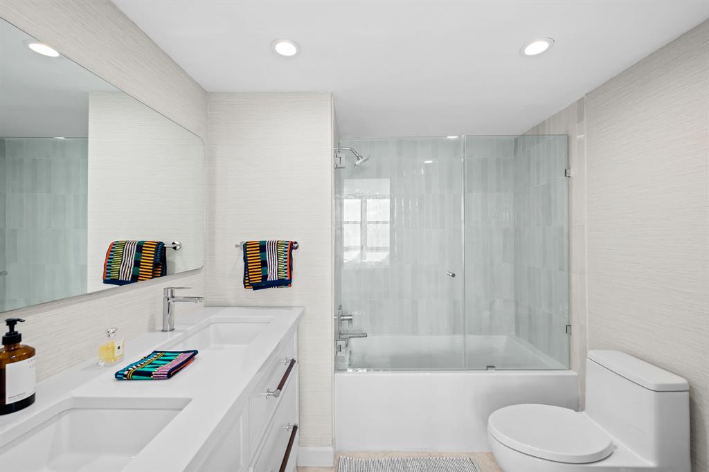 2841 North Ocean Boulevard, Unit 1508 Fort Lauderdale, FL 33308 - Photo 12 of 31 a bathroom with a sink a toilet and a bathtub