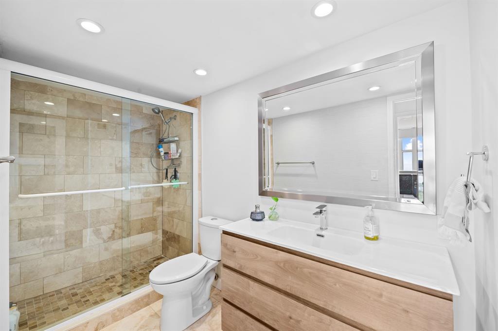 2841 North Ocean Boulevard, Unit 1508 Fort Lauderdale, FL 33308 - Photo 15 of 31 a bathroom with a sink a toilet and shower