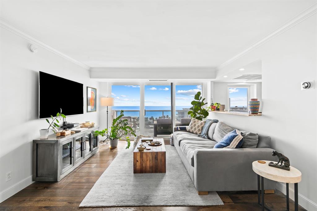 2841 North Ocean Boulevard, Unit 1508 Fort Lauderdale, FL 33308 - Photo 2 of 31 a living room with furniture and a flat screen tv