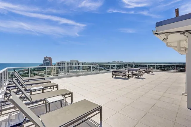 a roof view with sitting space and garden view