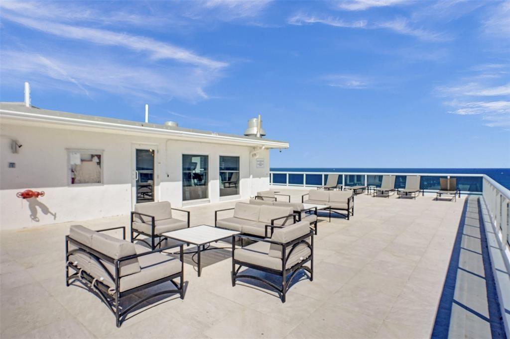 2841 North Ocean Boulevard, Unit 1508 Fort Lauderdale, FL 33308 - Photo 26 of 31 a roof deck with couches and potted plants