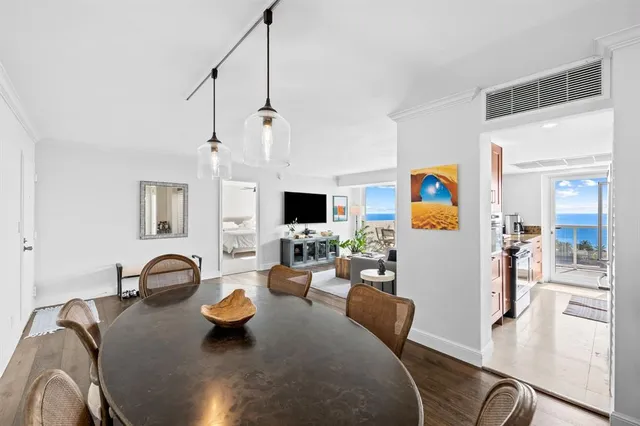 a kitchen with granite countertop a sink stainless steel appliances and cabinets