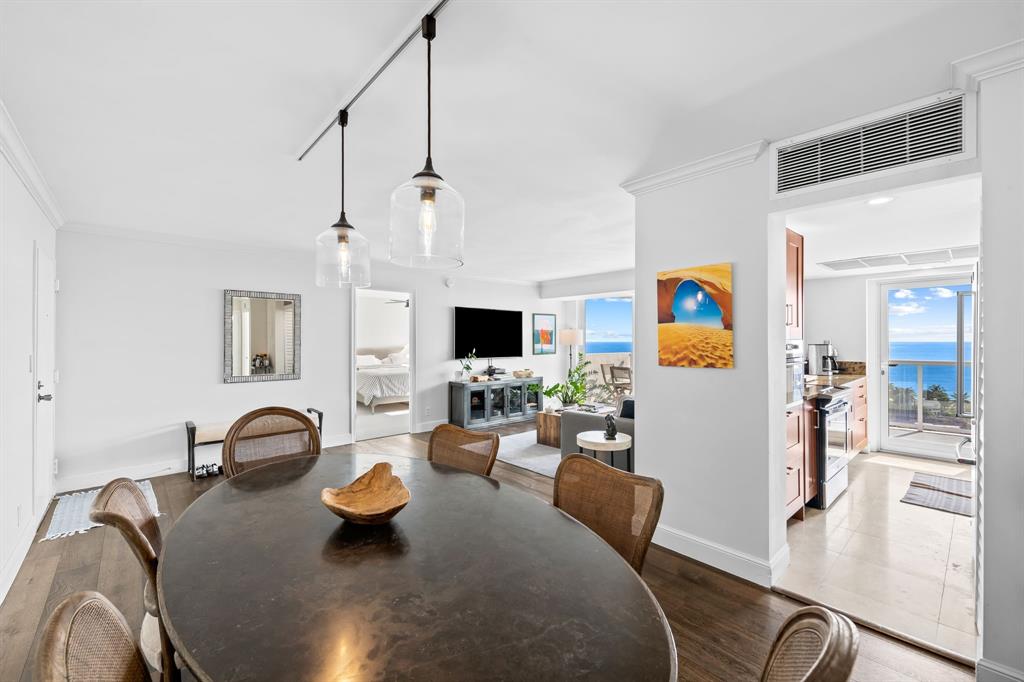 2841 North Ocean Boulevard, Unit 1508 Fort Lauderdale, FL 33308 - Photo 6 of 31 a living room with furniture and flat screen tv
