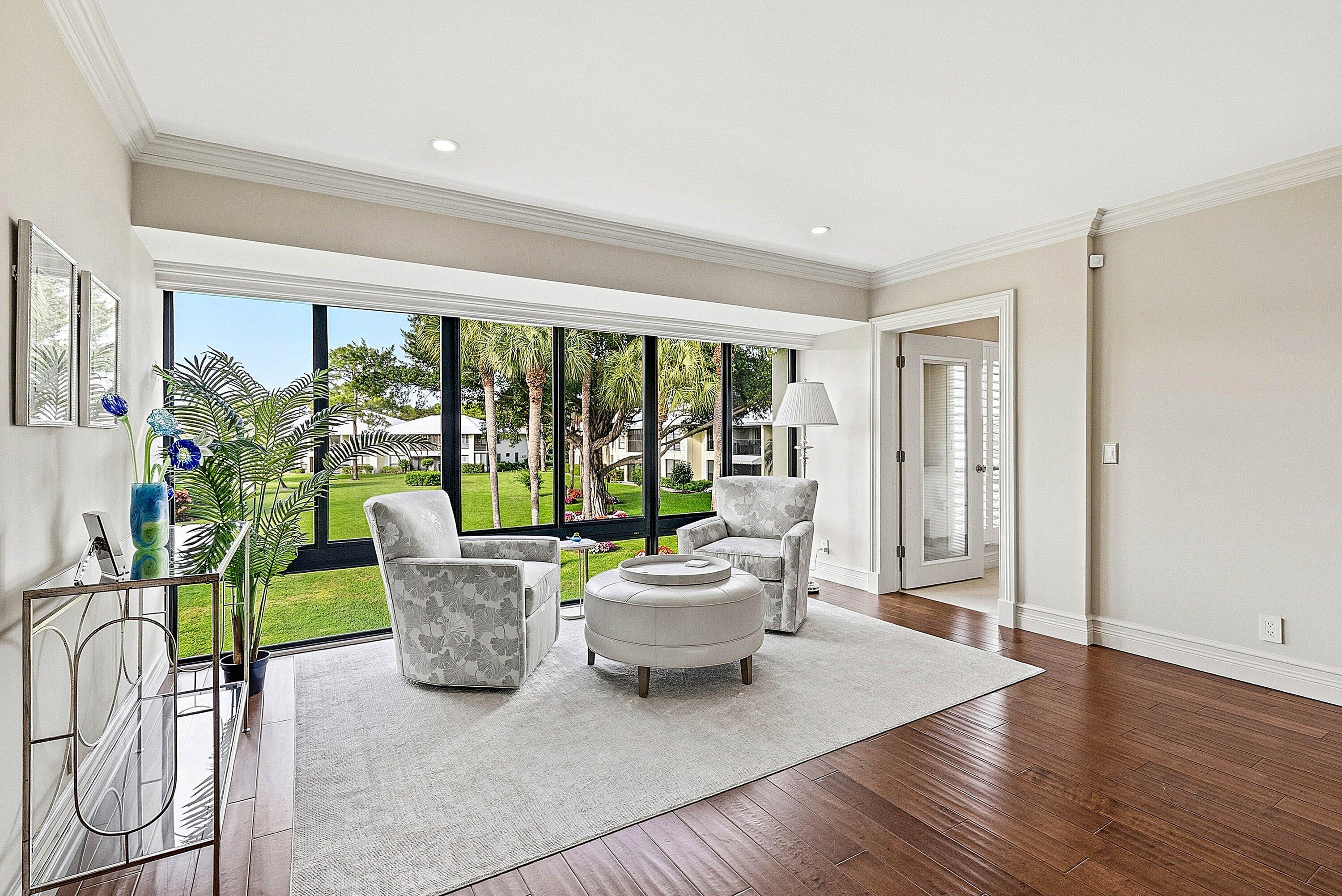 3675 Quail Ridge Drive, Unit BOBWHITE B Boynton Beach, FL 33436 - Photo 14 of 48 a living room with furniture and a large window
