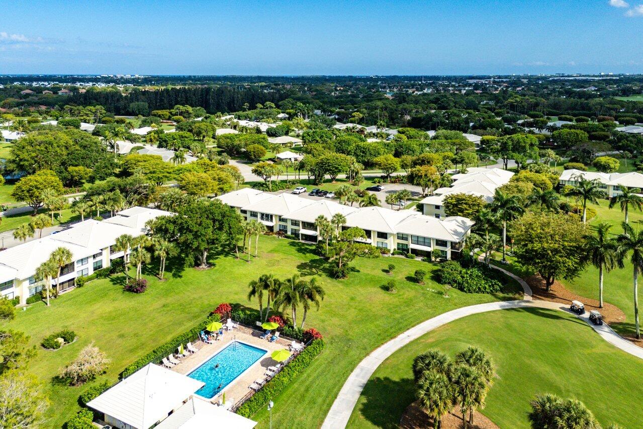 3675 Quail Ridge Drive, Unit BOBWHITE B Boynton Beach, FL 33436 - Photo 34 of 48 a view of a lake with houses