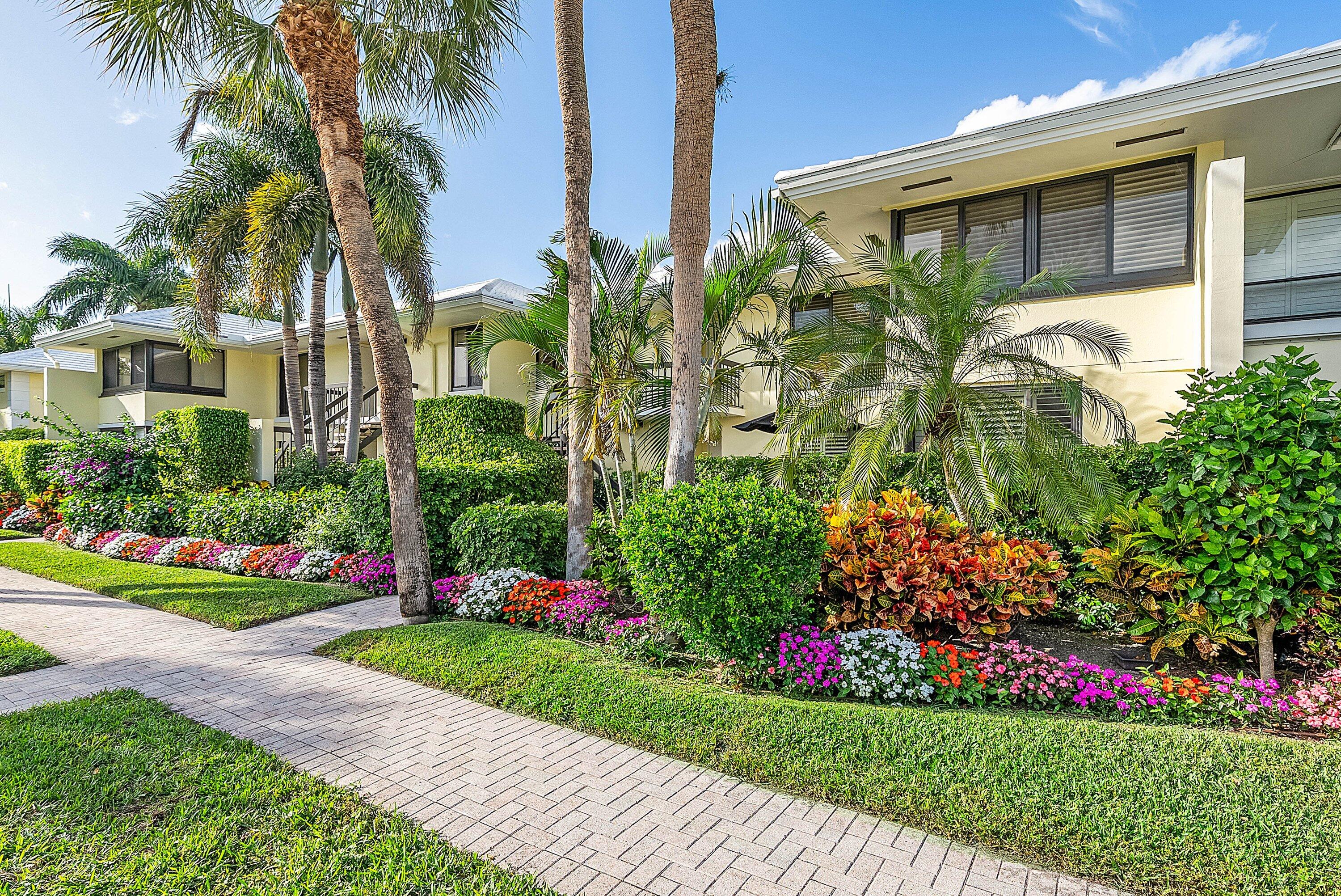 3675 Quail Ridge Drive, Unit BOBWHITE B Boynton Beach, FL 33436 - Photo 38 of 48 a view of a garden with a flower garden