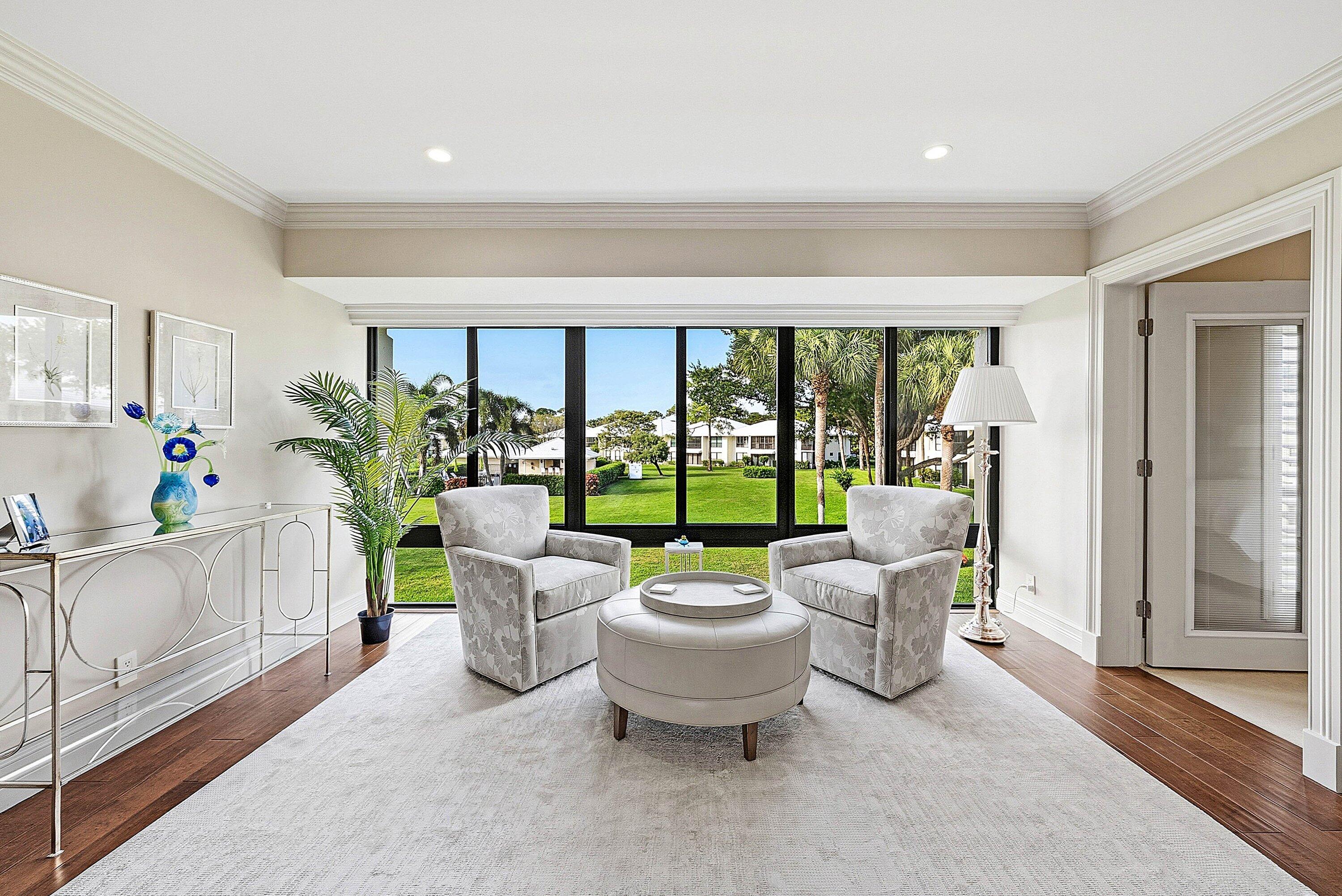 3675 Quail Ridge Drive, Unit BOBWHITE B Boynton Beach, FL 33436 - Photo 4 of 48 a living room with furniture and a large window