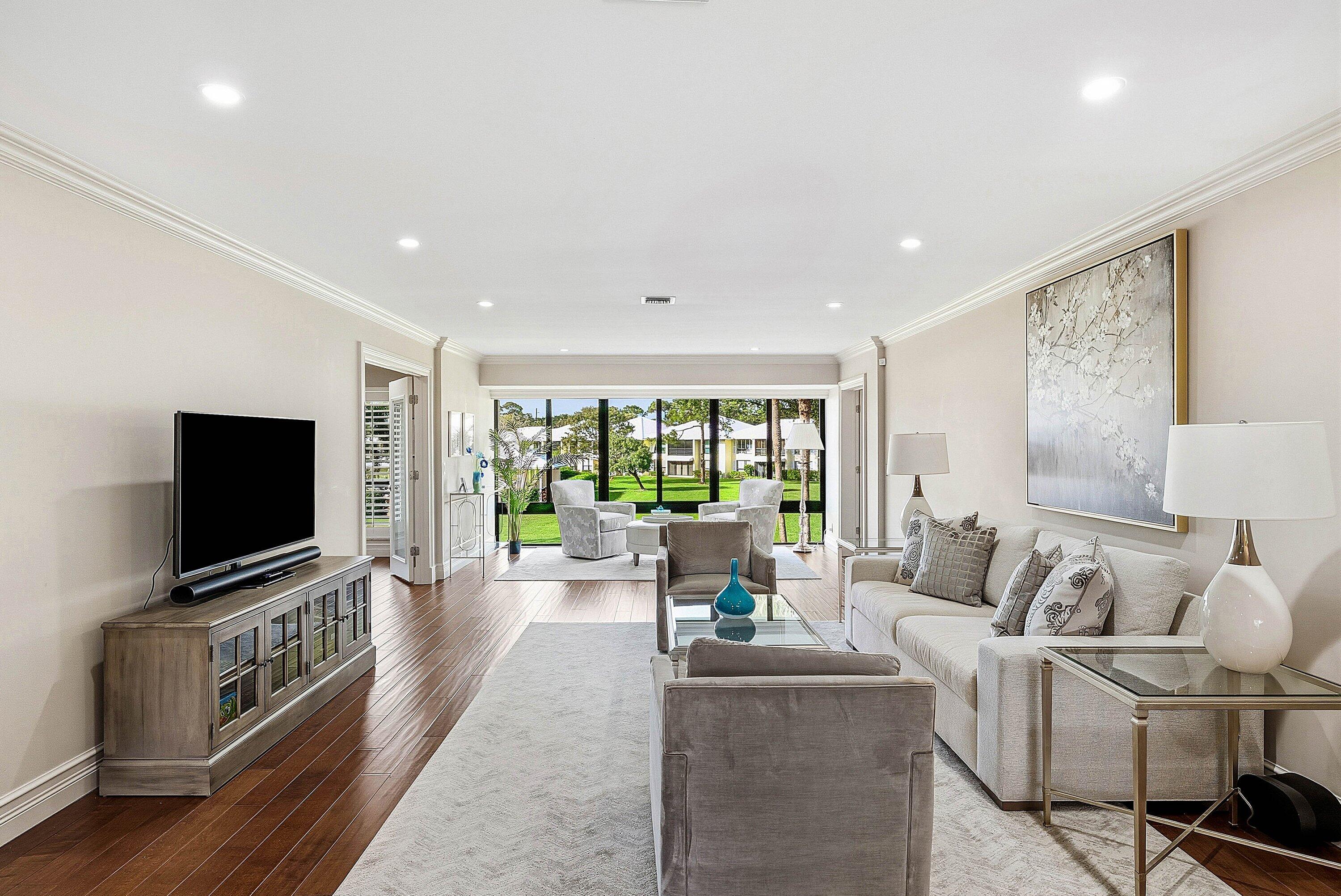 3675 Quail Ridge Drive, Unit BOBWHITE B Boynton Beach, FL 33436 - Photo 7 of 48 a living room with furniture and a flat screen tv