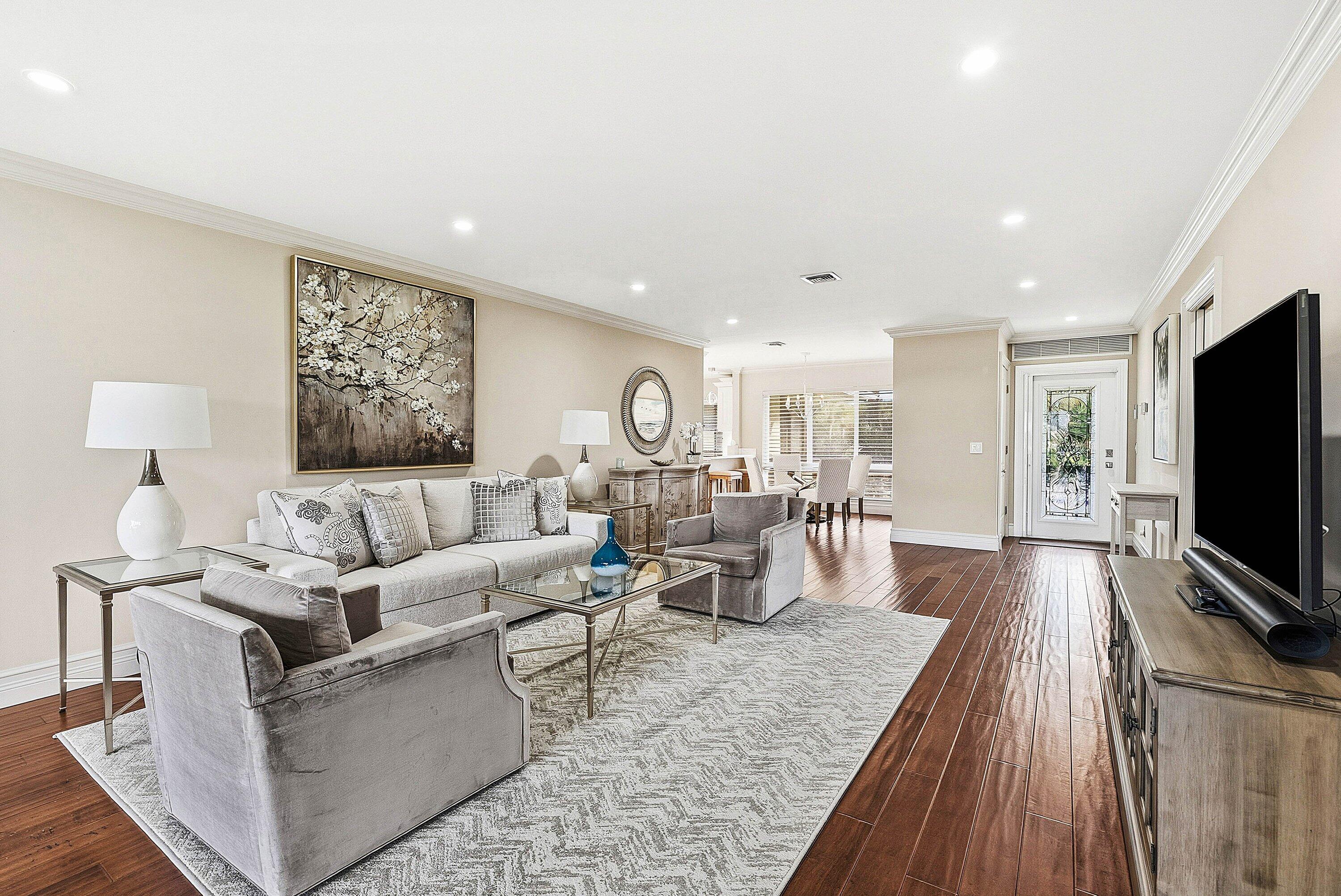 3675 Quail Ridge Drive, Unit BOBWHITE B Boynton Beach, FL 33436 - Photo 8 of 48 a living room with furniture and a flat screen tv