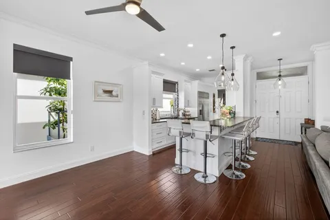 a kitchen with sink stove and cabinets