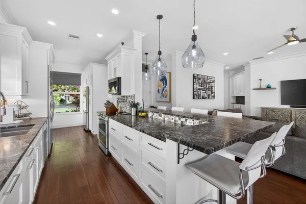 a kitchen with sink and cabinets