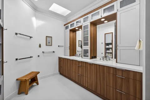 a bedroom with a bed and a flat tv screen