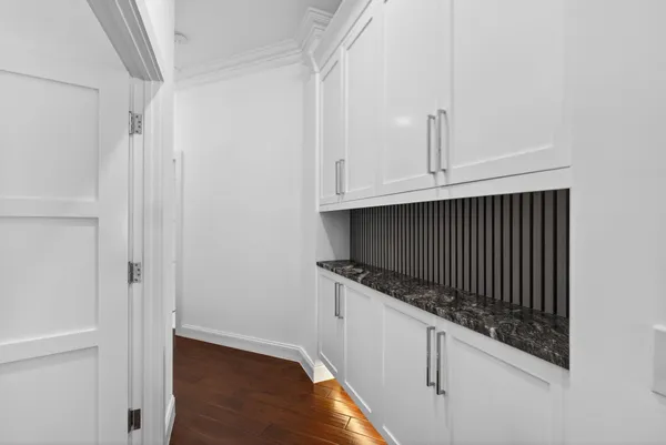 a bathroom with a shower a toilet and a sink