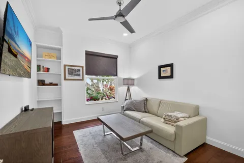 a bathroom with a sink mirror and toilet