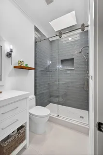 a view of a house with swimming pool and sitting area