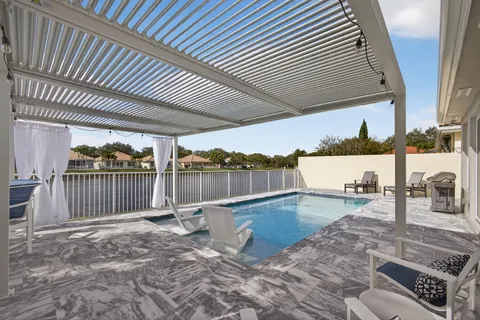 a view of a lake with houses in the back