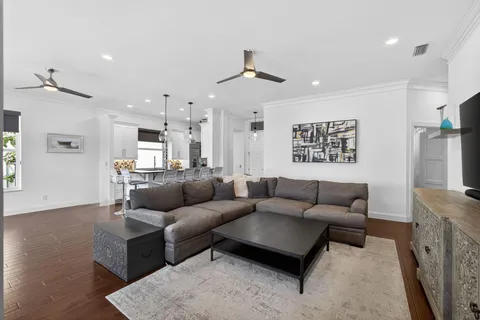 a living room with fireplace furniture and a flat screen tv