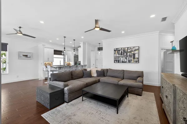 a living room with fireplace furniture and a flat screen tv