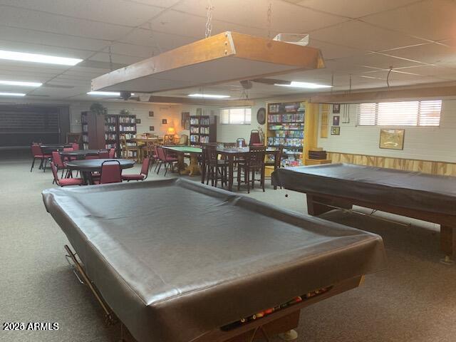 2528 East McKellips Road, Unit 146 Mesa, AZ 85213 - Photo 25 of 41 a kitchen with a table chairs and a chandelier