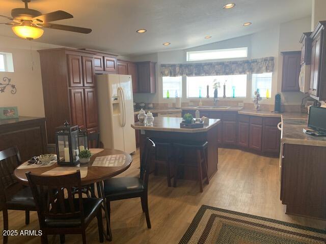 2528 East McKellips Road, Unit 146 Mesa, AZ 85213 - Photo 3 of 41 a kitchen with a table chairs and microwave