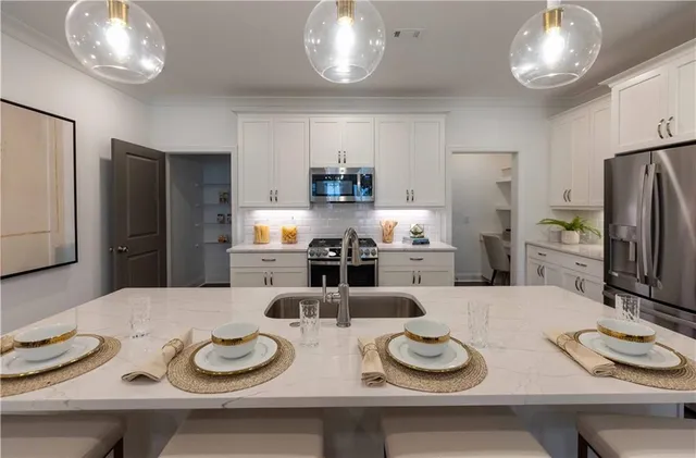 a kitchen that has microwave and stove