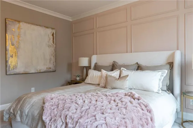 a bedroom with a bed and night stand