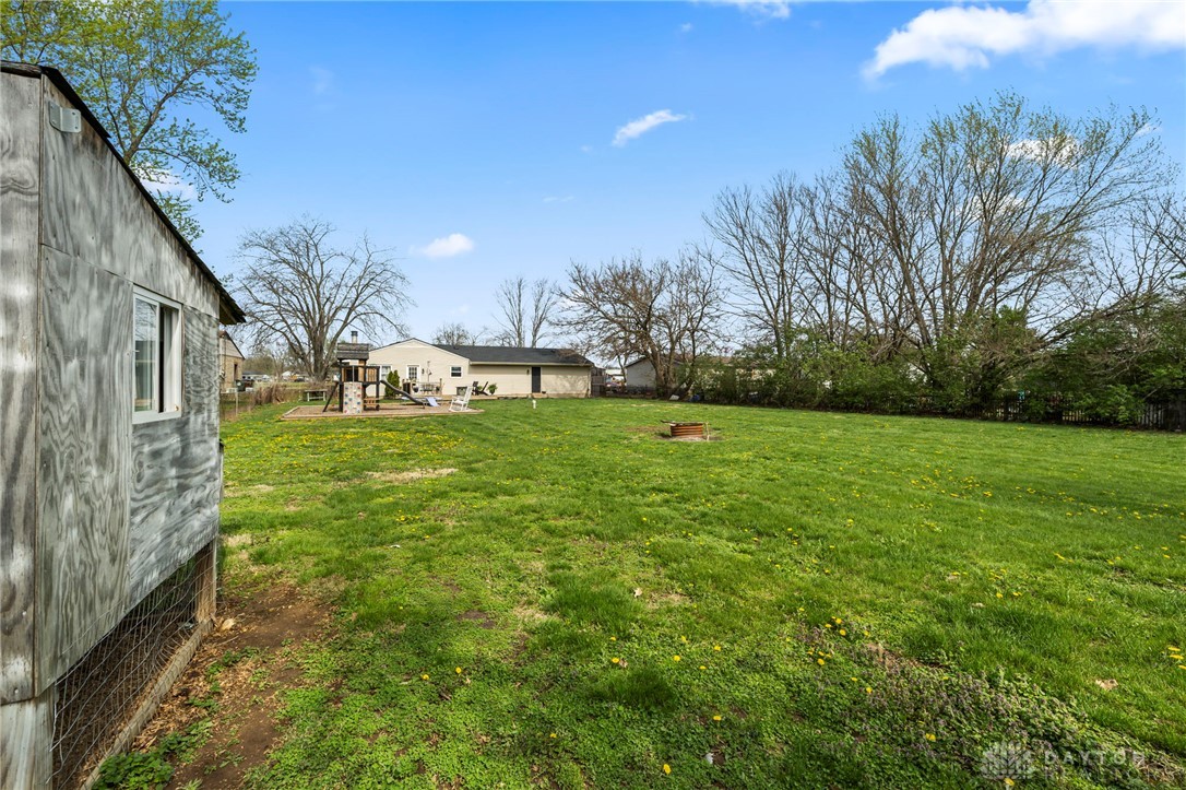 8969 Franklin-Trenton Road Franklin, OH 45005 - Photo 11 of 49 Expansive green lawn perfect for outdoor activities, offering ample space for recreation and relaxation.