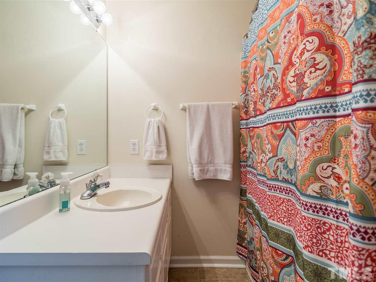 7273 Turner Fish Road Willow Spring, NC 27592 - Photo 17 of 25 The master bath has a tub/shower combination.