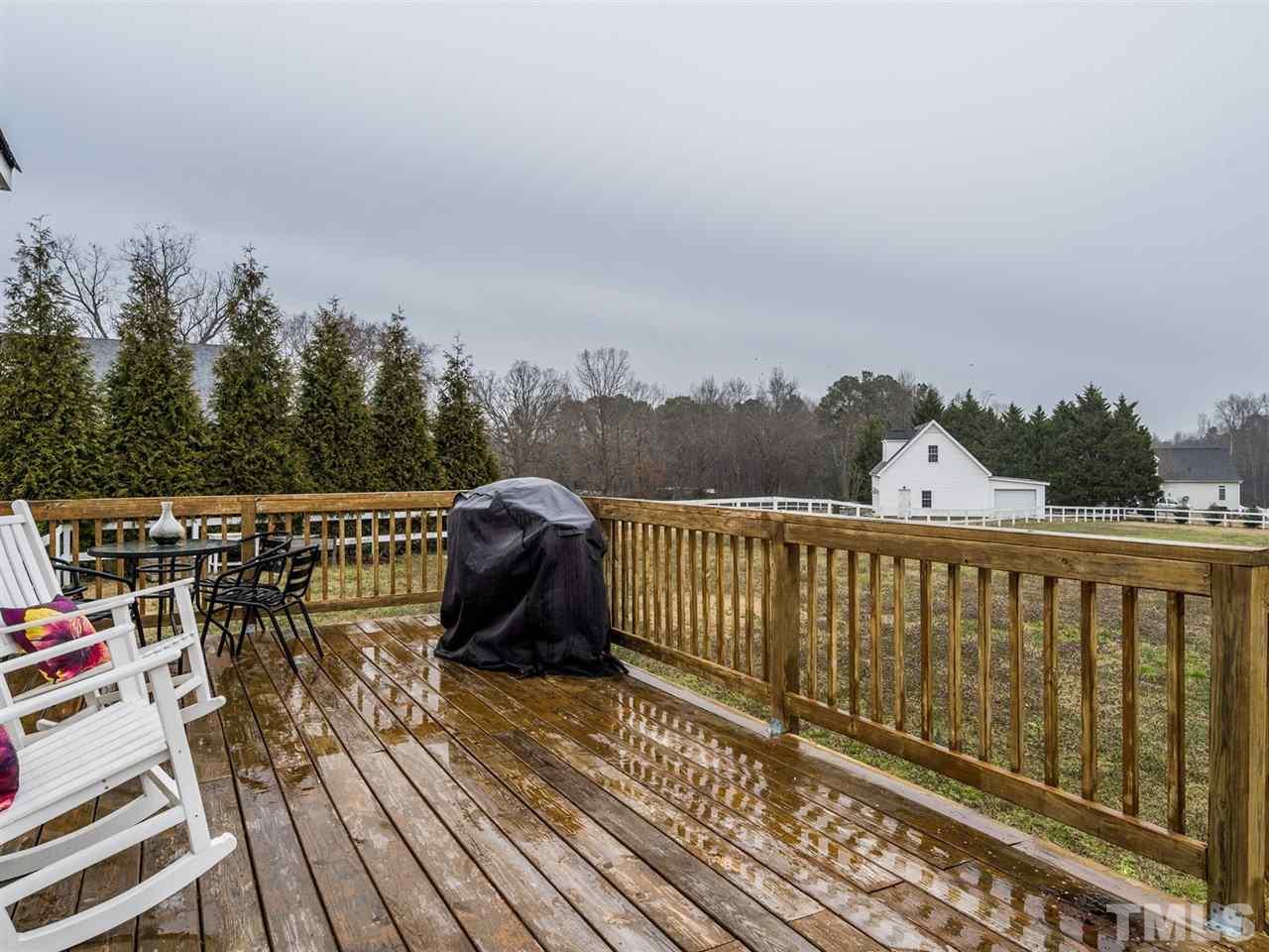 7273 Turner Fish Road Willow Spring, NC 27592 - Photo 22 of 25 Enjoy relaxing or entertaining on the deck. Just bring your grill and you're ready to cookout!