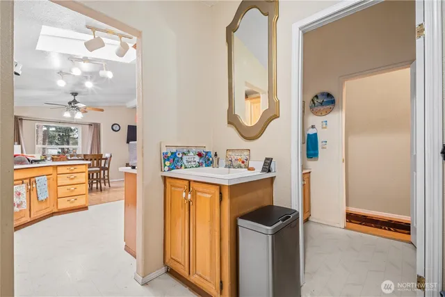 a bathroom with a sink a mirror and a bath tub