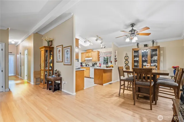 a view of a dining room with furniture and chandelier
