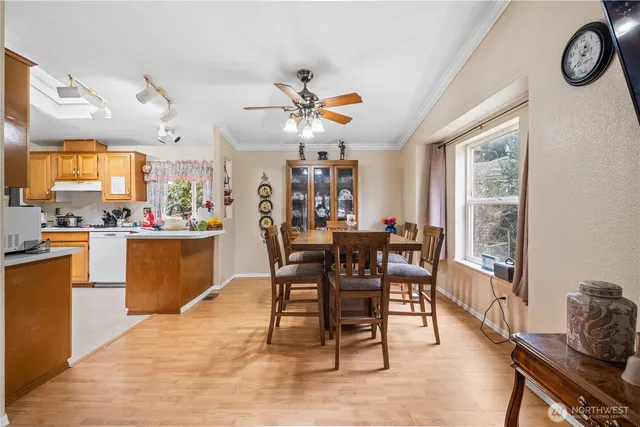 a view of a dining room with furniture window and outside view